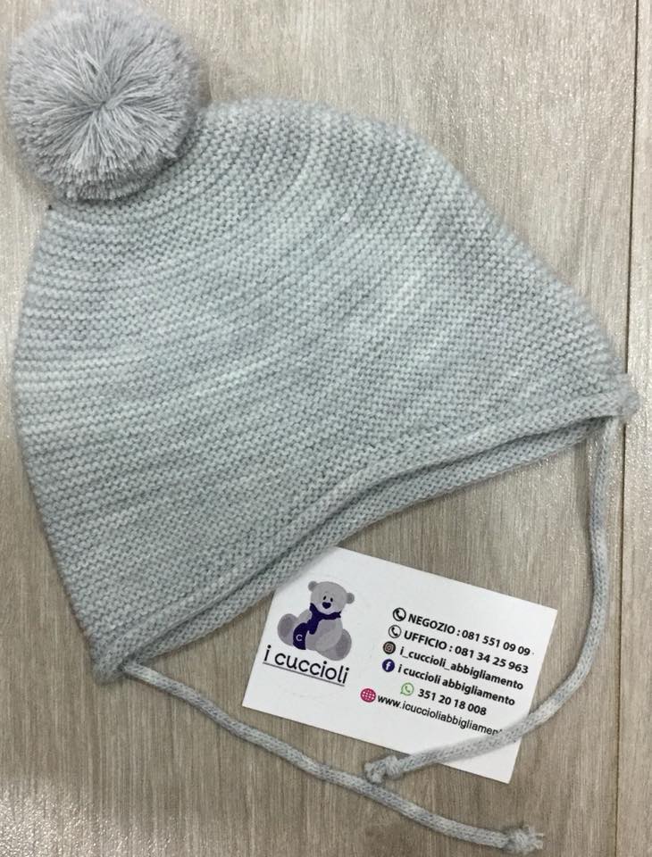 Cappellino in maglia con pom pom